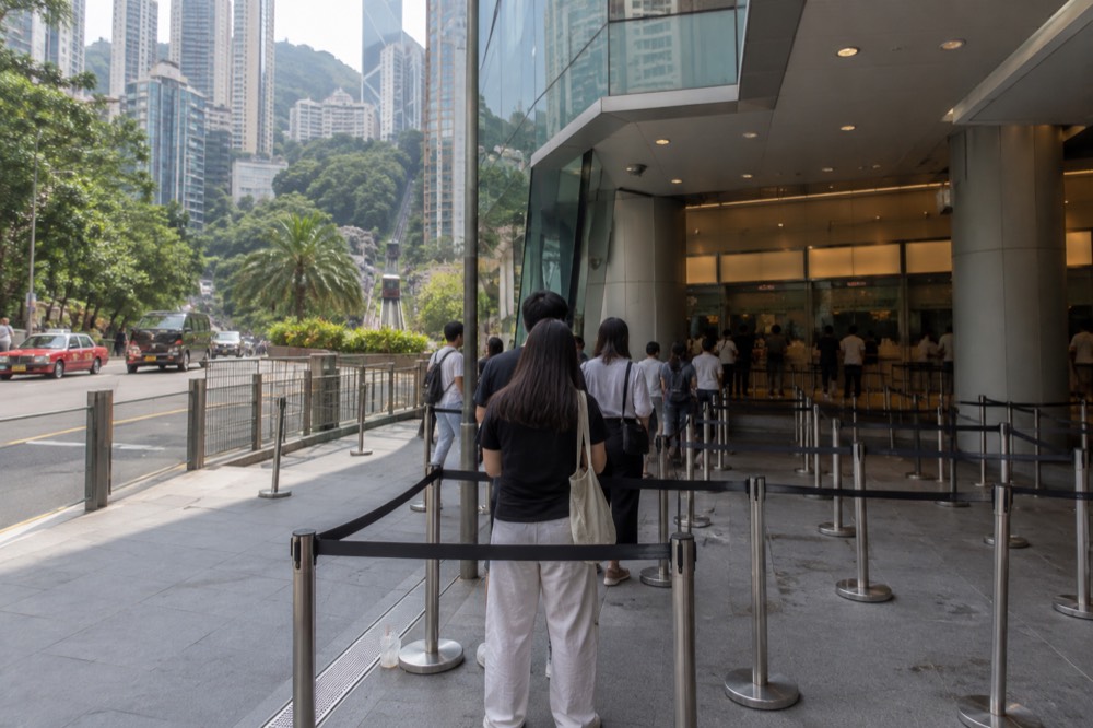 Queue barriers and the entrance of the Peak Tram lower terminus building on Garden Road