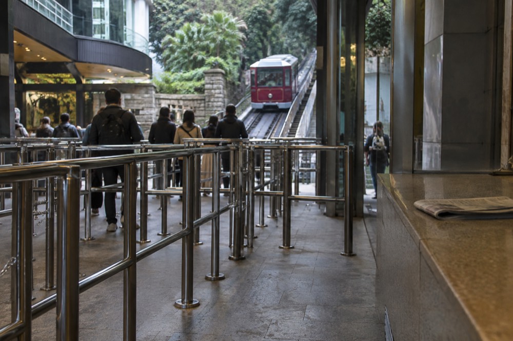 Queue barriers and entrance gates at the Peak Tram lower terminus on Garden Road in Central