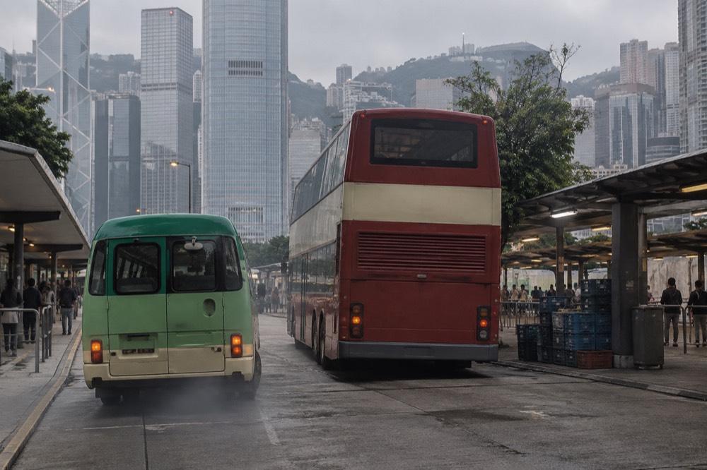 Green minibus and double decker bus at a Peak transport terminus
