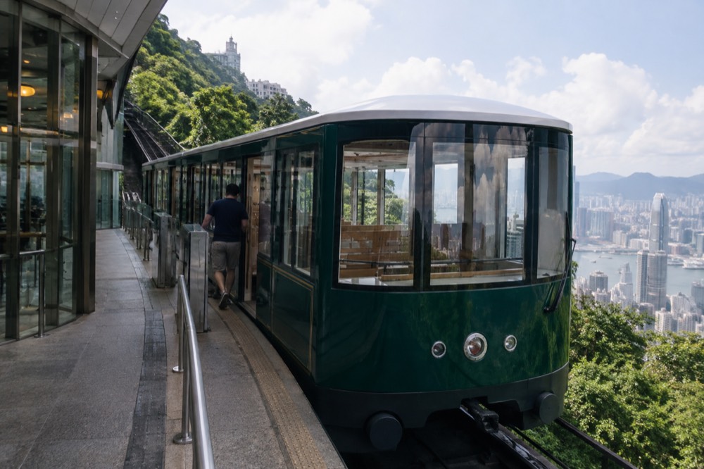 Green sixth-generation Peak Tram car at the upper terminus platform