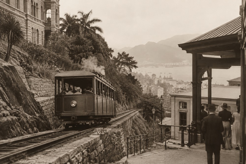Historic black-and-white photograph of an early Peak Tram car on the inclined track