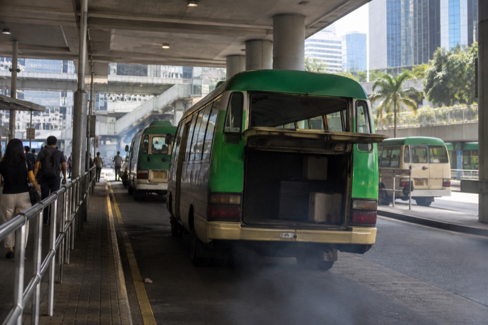 Green minibus parked at a Hong Kong transport terminus